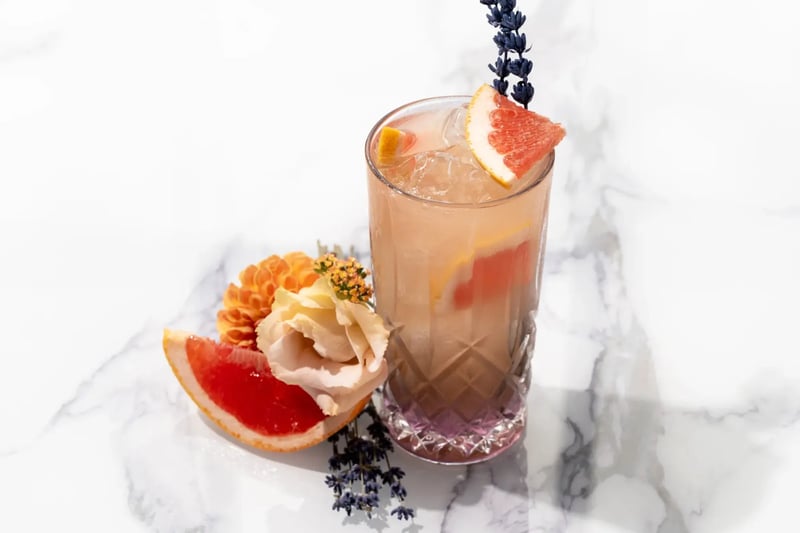 Orange drink with fruit and flowers to garnish at High House