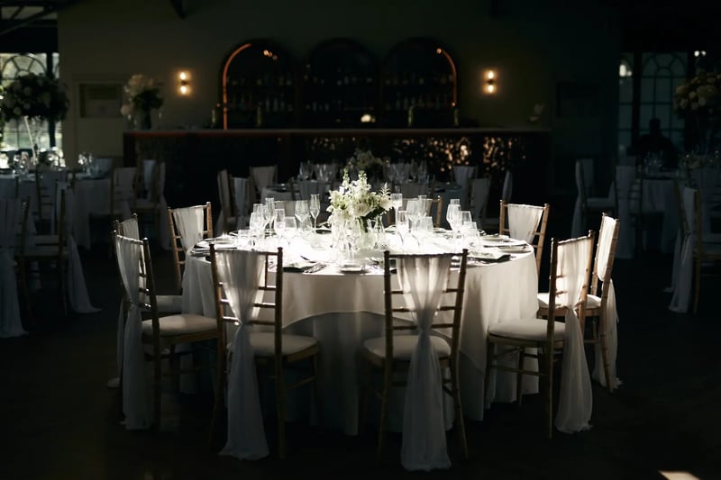 Circle table dressed for a wedding with flowers at High House