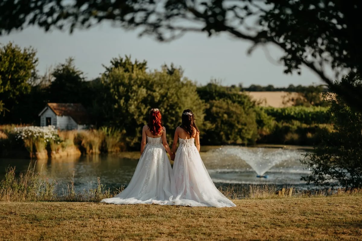 Brides looking out over the lake at High House