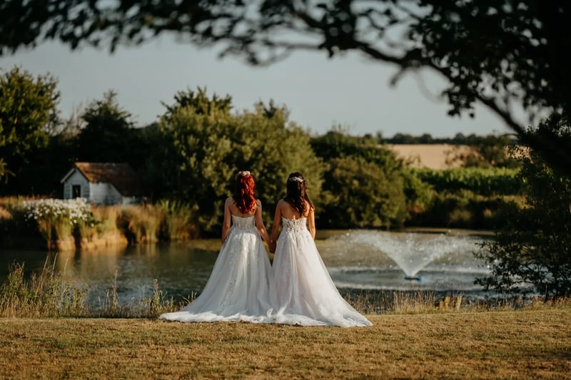 Brides looking out over the lake at High House