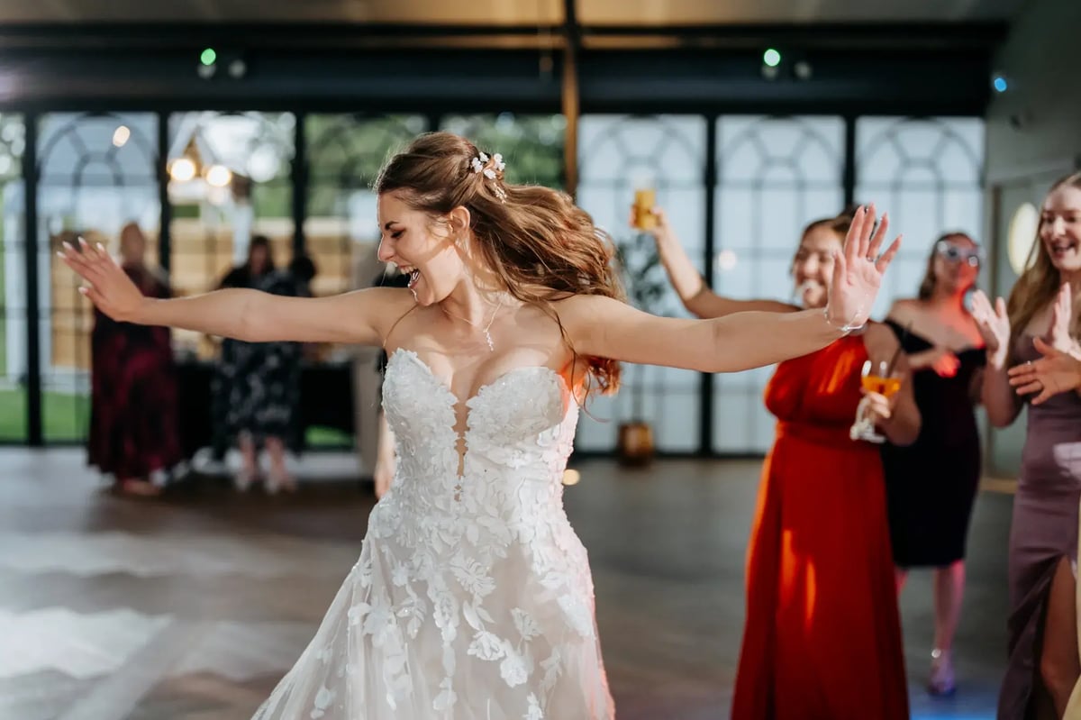 Bride dancing inside the Orangery at High House 