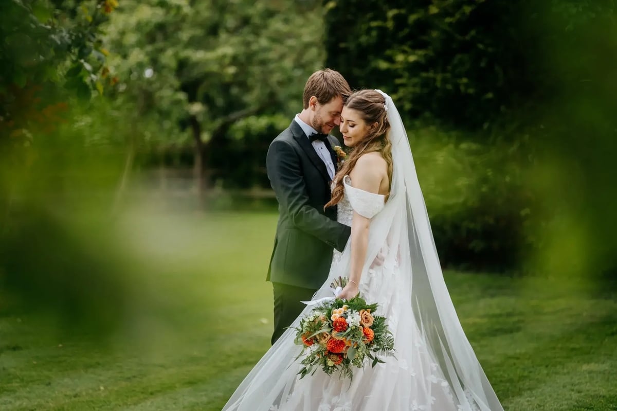 couple posing for photos in high house gardens