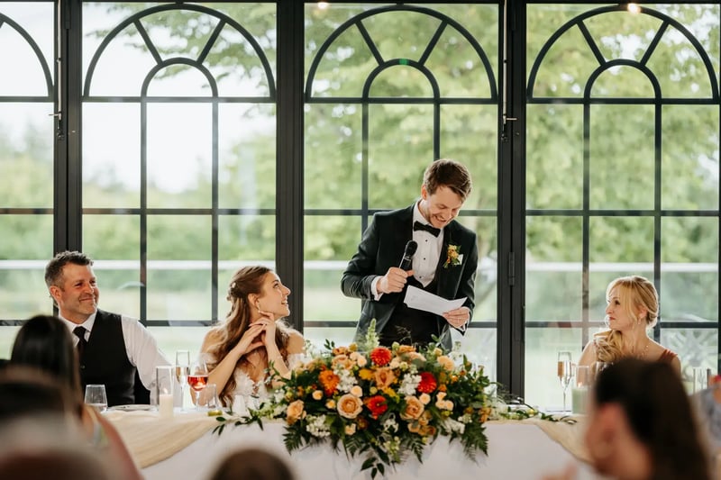 Groom reading his wedding speech in the Orangery at High House
