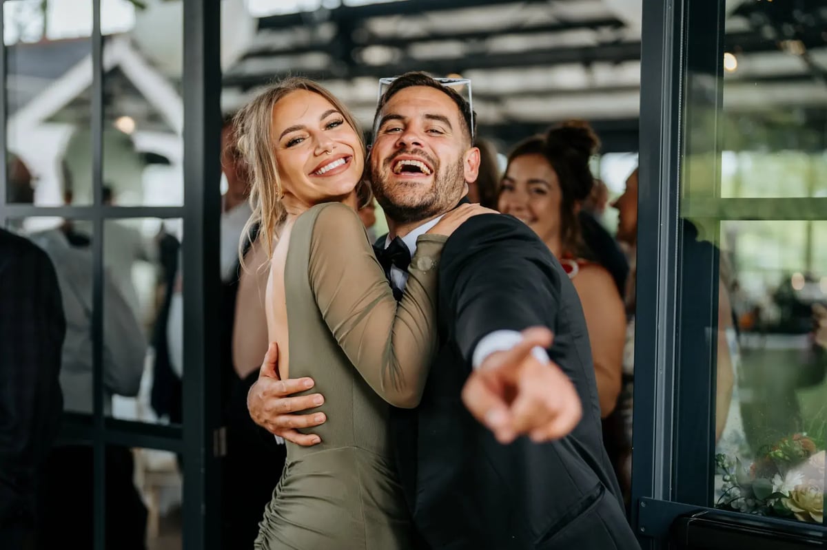 Guests smiling in the Orangery at High House