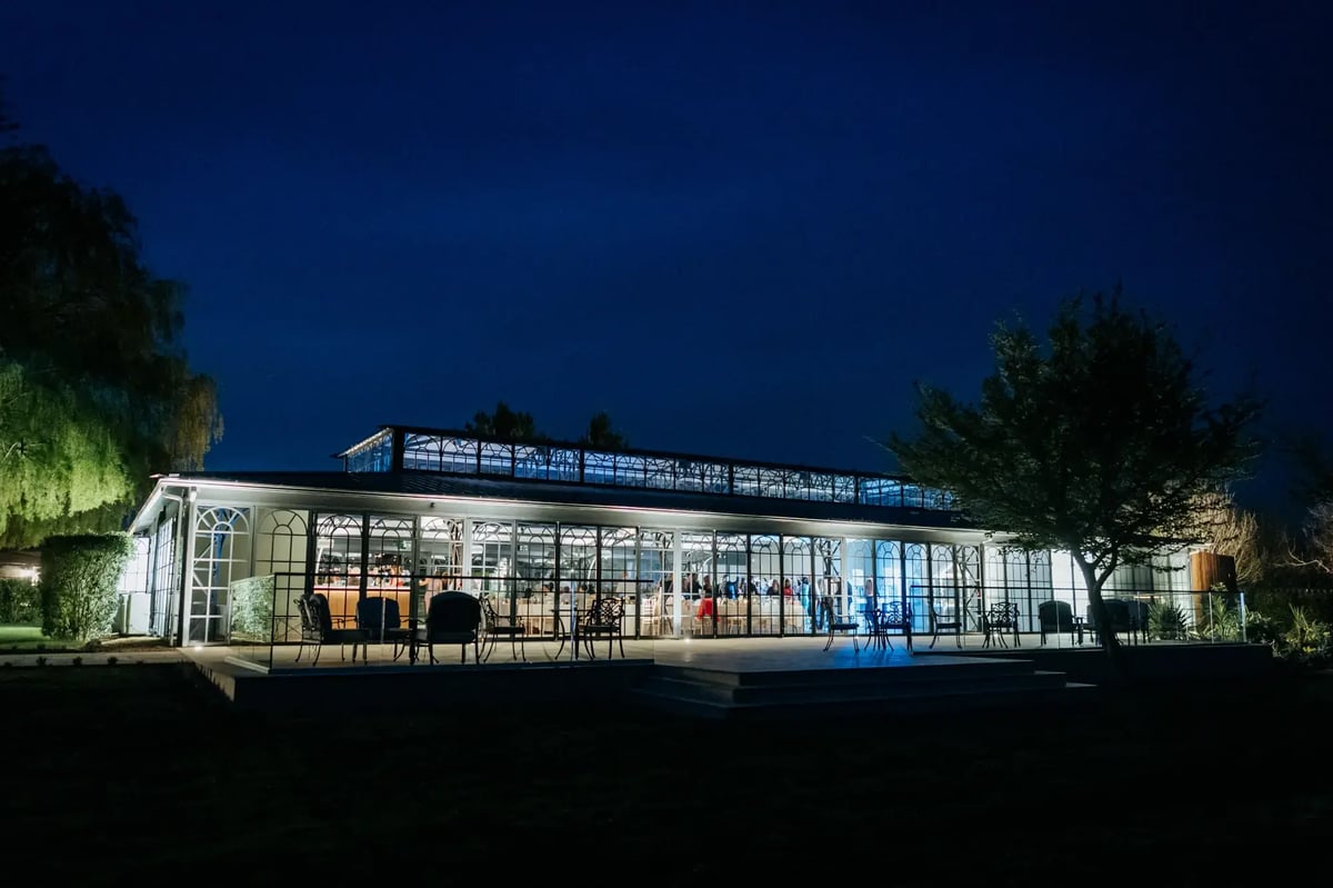 Outside of the Orangery during the night at High House