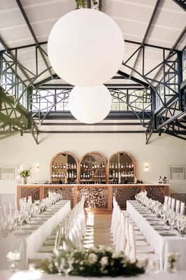 Long tables and the bar in the Orangery at High House
